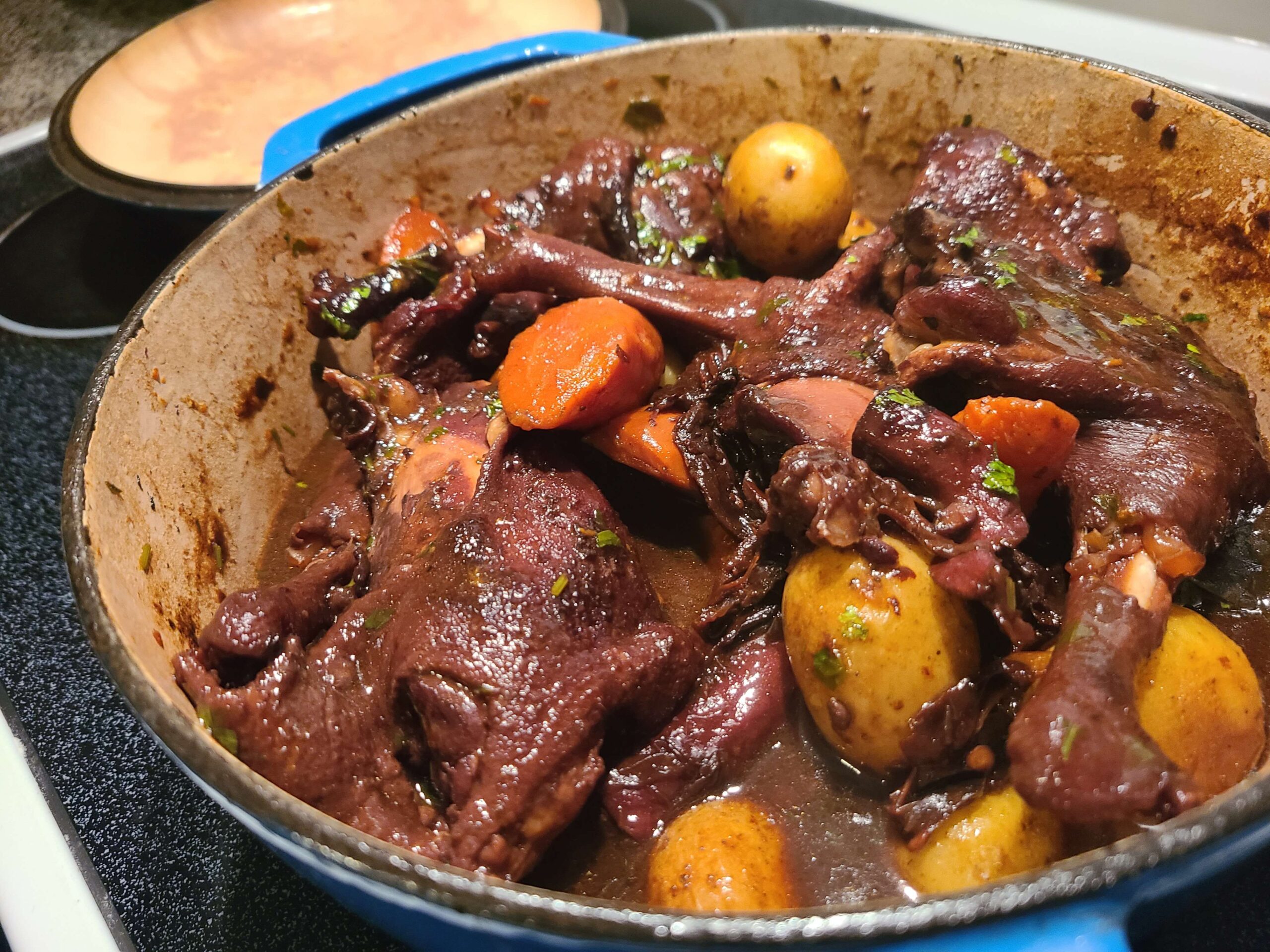 Coq au vin with potatoes and carrots