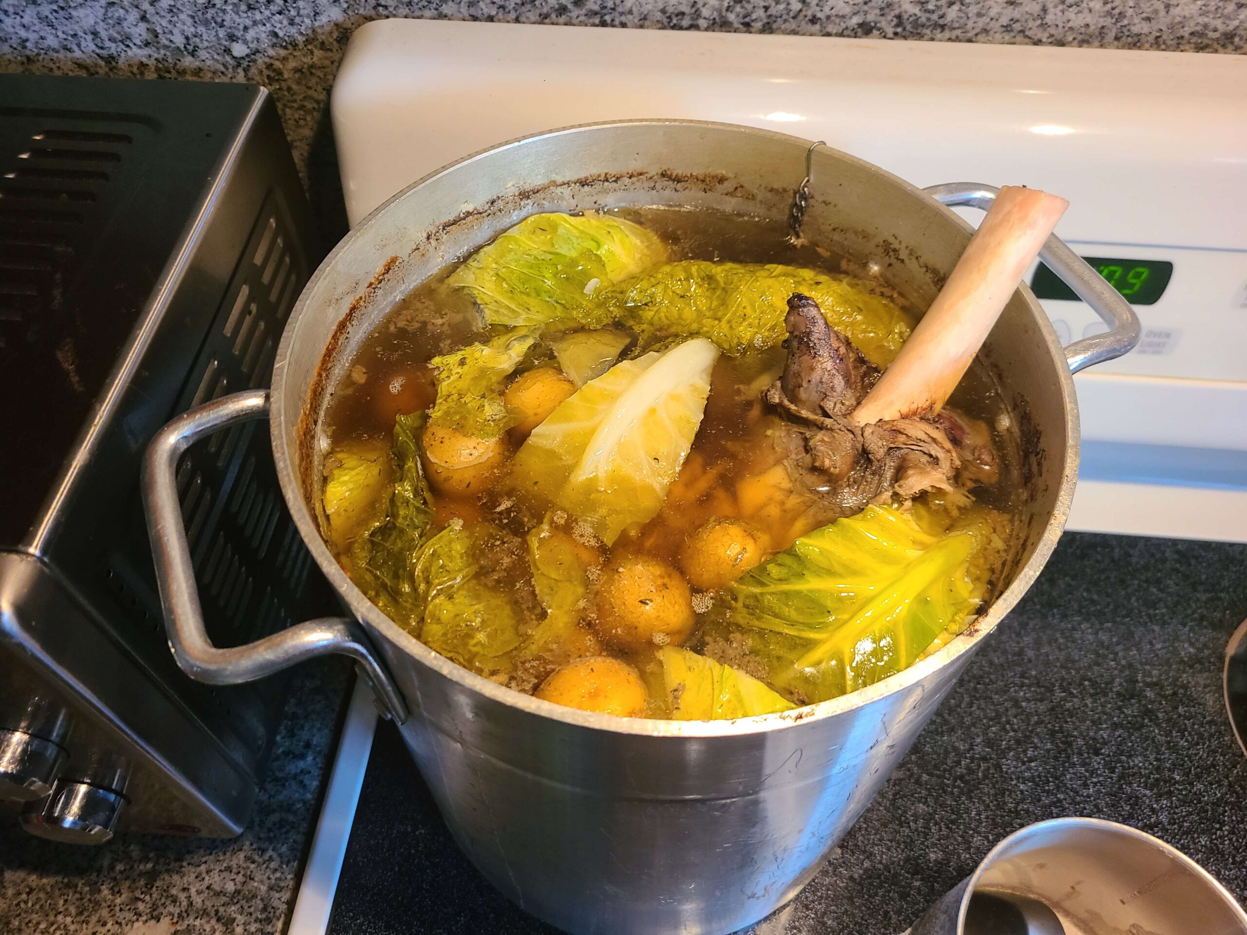 Whole leg of lamb, potatoes, and cabbage